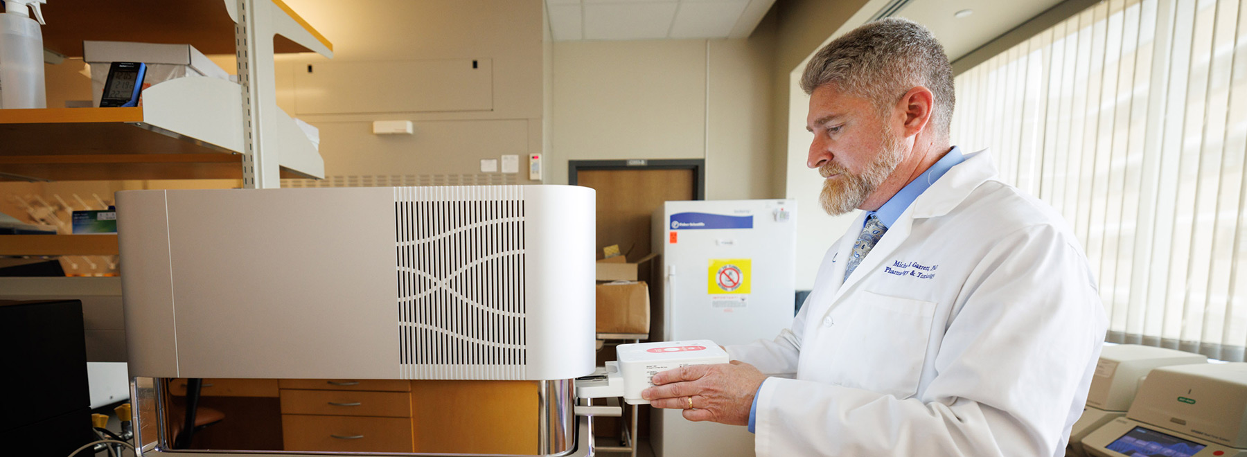 Dr. Michael Garrett conducted research in the Molecular and Genomics Core Facility that he established in 2010.